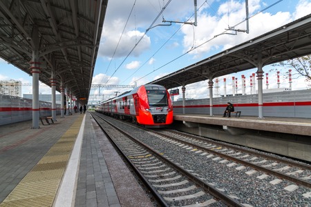 Moscow, Russia-October 01.2016. Train Swallow arrives at the station Shelepiha Moscow central ringのeditorial素材