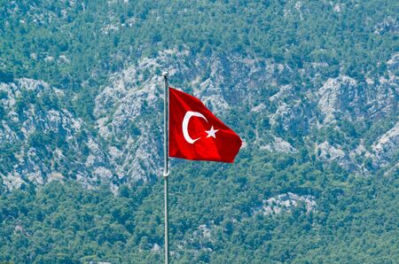 Turkish flag against the background of the Taurus mountainsの写真素材