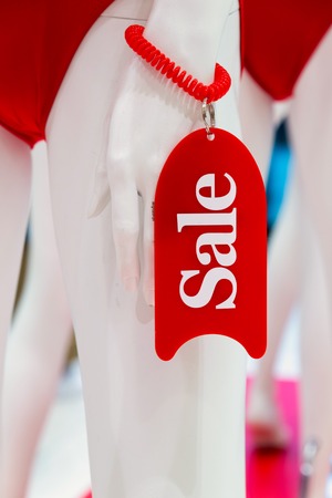 Sale - the inscription on the plate on the arm of the dummy in the storeの写真素材