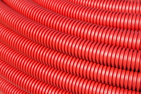 The roll of red Flexible Plastic Pipesの写真素材