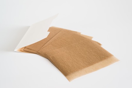 Matting cosmetic napkins to remove greasy gloss from the face.の写真素材