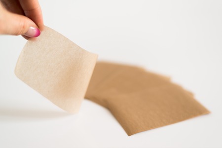 Matting cosmetic napkins to remove greasy gloss from the face.の写真素材