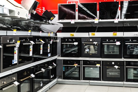 Moscow, Russia - February 20, 2018. Electric ovens and hobs in electronics store Eldoradoのeditorial素材