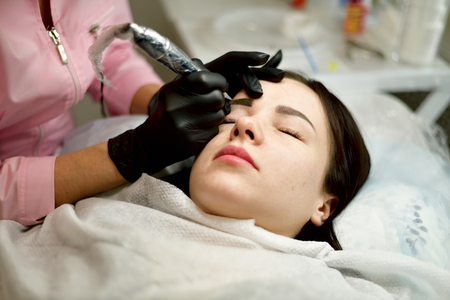 Master of permanent machine tattoo from workの写真素材