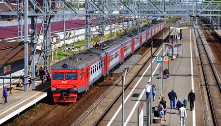 Skhodnya, Russia - May 09. 2018. train of company RZD arrives at stationのeditorial素材