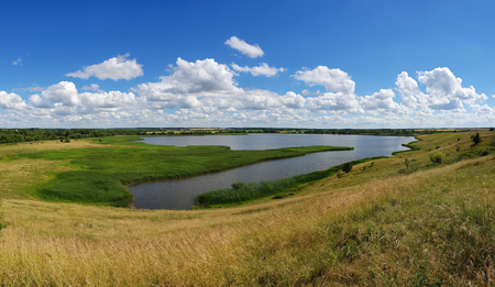 Panorama of a summer landscape with a pond in Russiaの写真素材