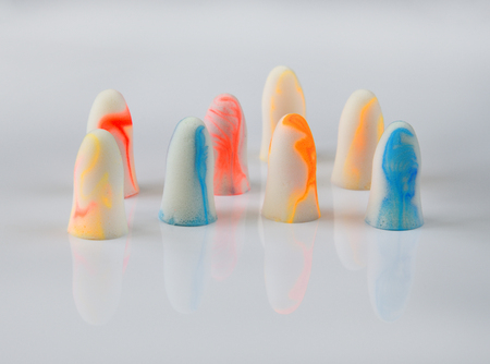 several earplugs on a white background