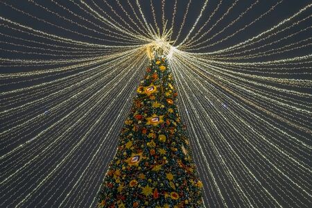 Moscow, Russia -January 2. 2019. Beautiful spruce on Lubyanka Square during festival Journey to Christmas. Decoration with logo Promsvyazbankのeditorial素材