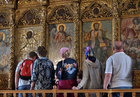 Larnaca, Cyprus - November 2. 2018. Believers near icons in church of St. Lazarus