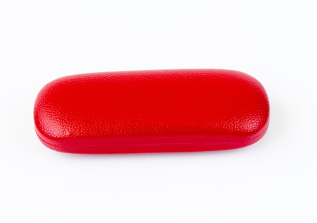 Closed red glasses case on white backgroundの写真素材