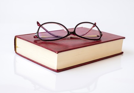 Stylish glasses for women with monofocal lenses and bookの写真素材