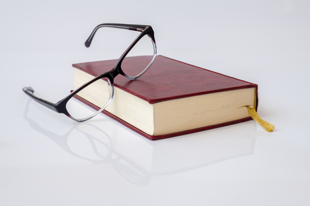 Stylish glasses for women with monofocal lenses and bookの写真素材