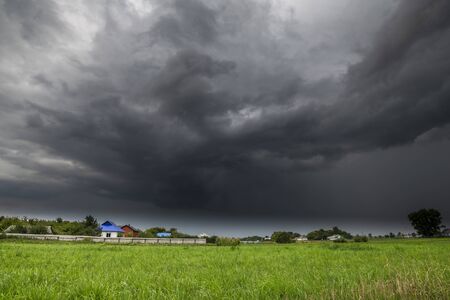 The Summer countryside landscape with a thundercloudの写真素材