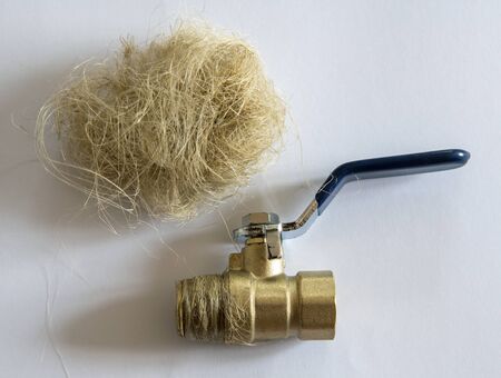 Ball valve and linen tow on a light background