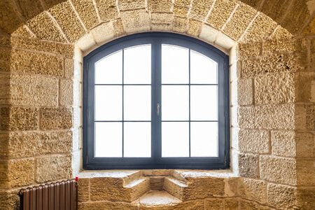 Fragment of stone wall with a window
