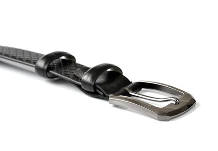 Fragment of black leather belt with a metal buckleの写真素材