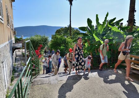 Herceg Novi, Montenegro - June 10. 2019. group of tourists is walking in the historical part of the...