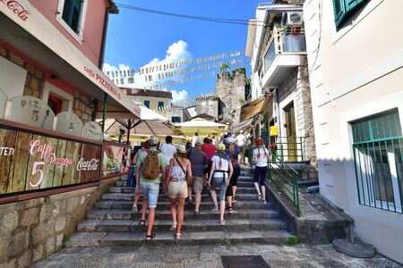 Herceg Novi, Montenegro - June 10. 2019. group of tourists is walking in the historical part of the cityのeditorial素材