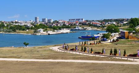 Sevastopol, Crimea - July 3.2019. Ruin of ancient city of Khersones Tavricheskiy against the background of modern housesのeditorial素材