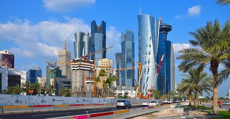 Doha, Qatar - Nov 29. 2019. Different construction equipment against background of downtown...