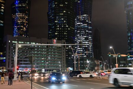 Doha, Qatar - Nov 18. 2019. A Night cityscape downtown at Omar Al Mukhtar Street