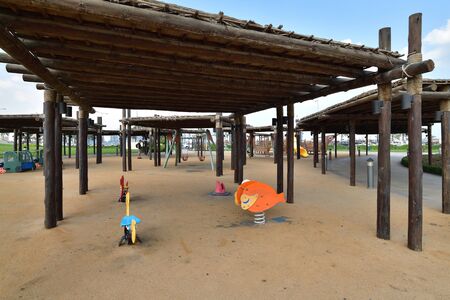 Doha, Qatar - Nov 21. 2019. Playground with wooden sunshade in a Souq Waqif Gardenのeditorial素材