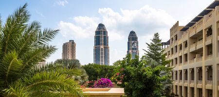 Doha, Qatar - Nov 19. 2019. Modern skyscrapers on Pearl Island and fragments of a traditional architectureのeditorial素材