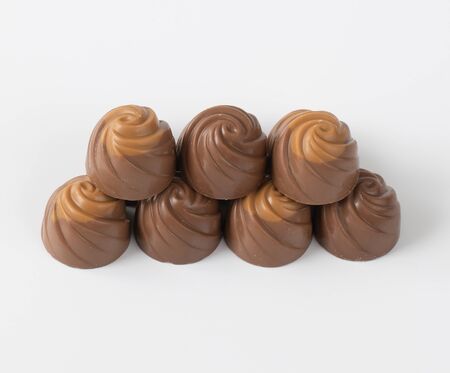 milk chocolate candies on light backgroundの写真素材