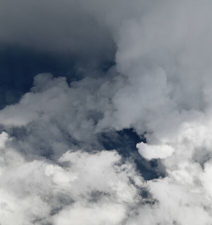 Fragment of stormy sky with white clouds