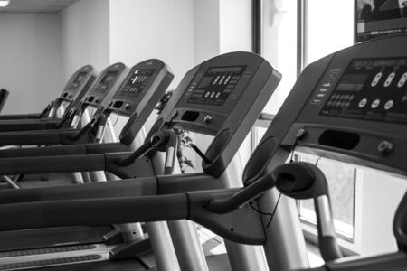 A number of treadmills in a gymの写真素材