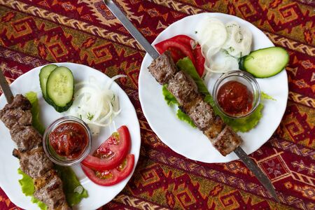 Barbecue on table covered with a tablecloth in the national Tatar styleの写真素材
