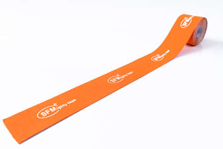 Berlin, Germany - March 15. 2020. Orange sports medical tape of a SFM Hospital Products GmbHのeditorial素材