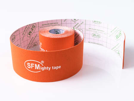 Berlin, Germany - March 15. 2020. Orange sports medical tape of a SFM Hospital Products GmbHのeditorial素材