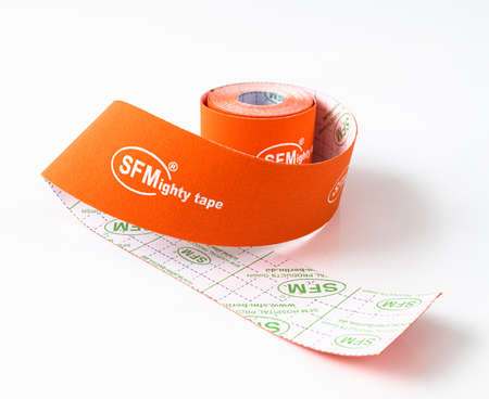 Berlin, Germany - March 15. 2020. Orange sports medical tape of a SFM Hospital Products GmbHのeditorial素材