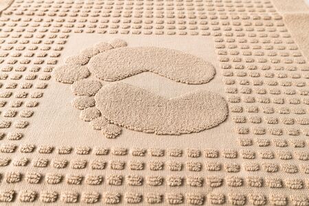 Pattern in the form of footprints on terry towelの写真素材
