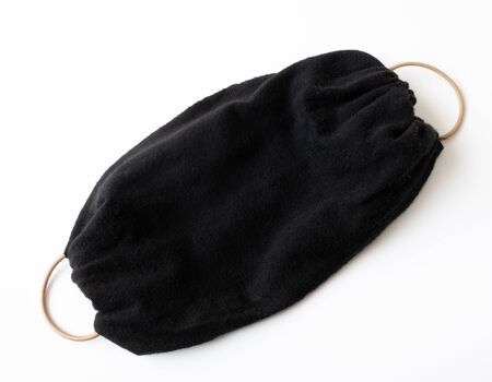 Black mask made by hand during a pandemic Covid-19 due to lack of industrial masks in pharmaciesの写真素材