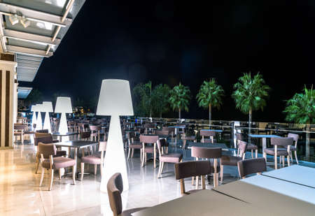 Protaras, Cyprus - Oct 12. 2019. Outdoor cafe near hotels in resort village of Protaras at nightのeditorial素材