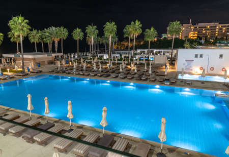 Protaras, Cyprus - Oct 12. 2019. swimming pool near hotels in resort village of Protaras at nightのeditorial素材