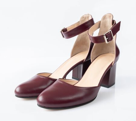 Womens leather cherry shoes on a white backgroundの写真素材