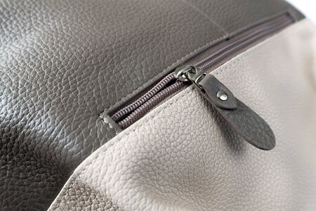 Zipper in brown leather women bag on a white backgroundの写真素材