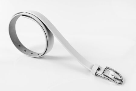 White leather belt on light backgroundの写真素材