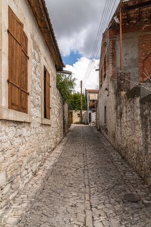 Narrow street in a tourist ancient village of Lania, Cyprusの写真素材