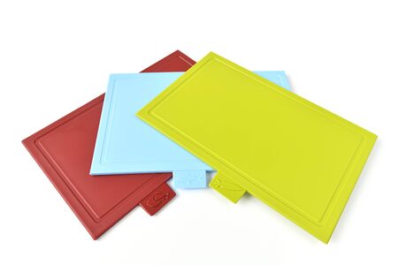 Colored plastic cutting boards on light backgroundの写真素材