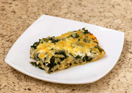 Slice of Ossetian pie with a cheese and herbsの写真素材