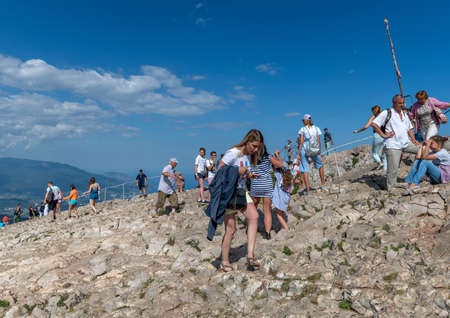Ai-Petri, Crimea - July 5, 2019. Tourists climb to the mountaintop, landmarkのeditorial素材