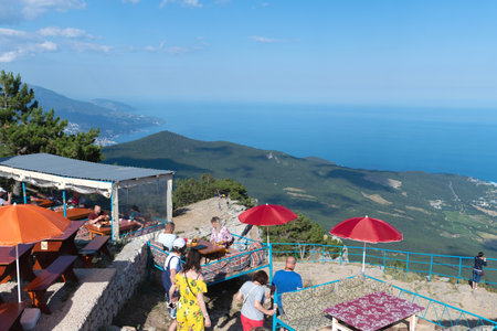 Ai-Petri, Crimea - July 5, 2019. Tourists in a cafe on the top of the mountainのeditorial素材