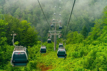 Rosa Khutor, Russia - June 1. 2018. The cable car in ski resort in summer in Estosadokのeditorial素材
