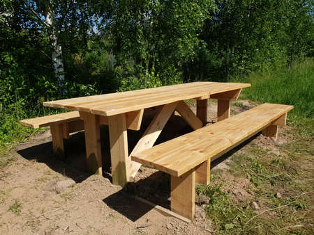 Wooden table and benches for outdoor recreationの写真素材