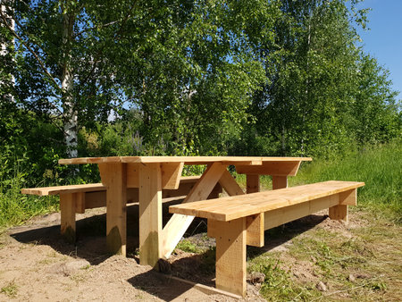 Wooden table and benches for outdoor recreationの写真素材