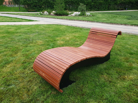 Wooden lounger for rest in city park in Moscow, Russiaの写真素材